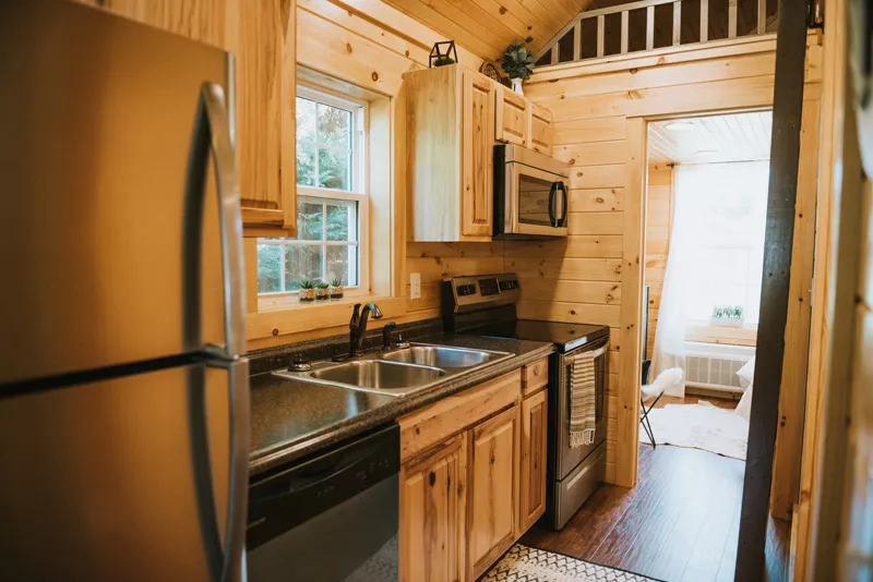 kitchen layout in modular log cabin with wood interior
