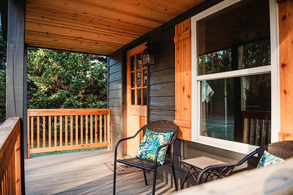 black and wood exterior on prefab log cabin
