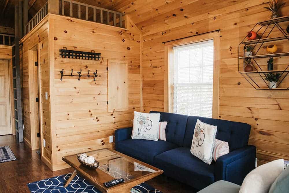 wood interior walls in living space in modular log cabin