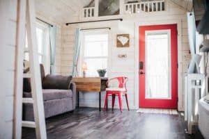 white and red cottage style interior in modular tiny home