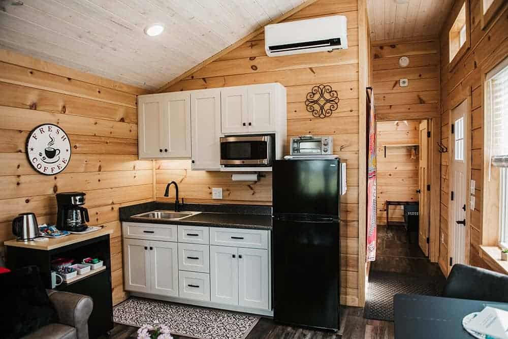 modern kitchen layout in wooden interior modular log cabin